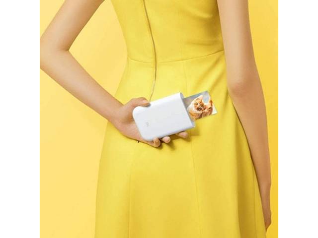 Imprime fotos al instante con la impresora portátil Xiaomi Mi. Su elegante color blanco y fácil conectividad hacen que revivir tus recuerdos sea sencillo y divertido. ¡Consíguela ya! 